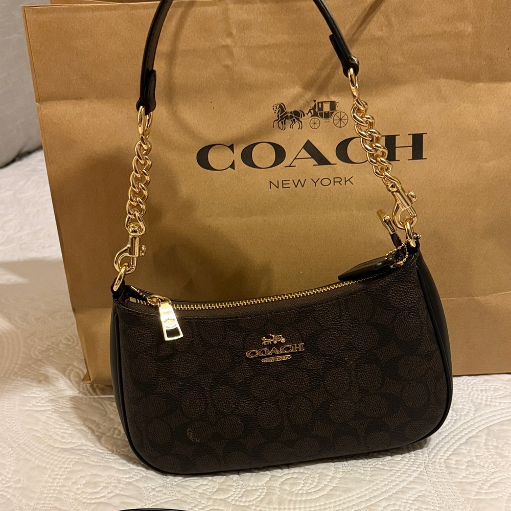 Teri shoulder bag. Coach Dark Brown Shoulder Bag with Gold Accents